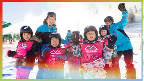 Snowboard instructors with a group of kiddos